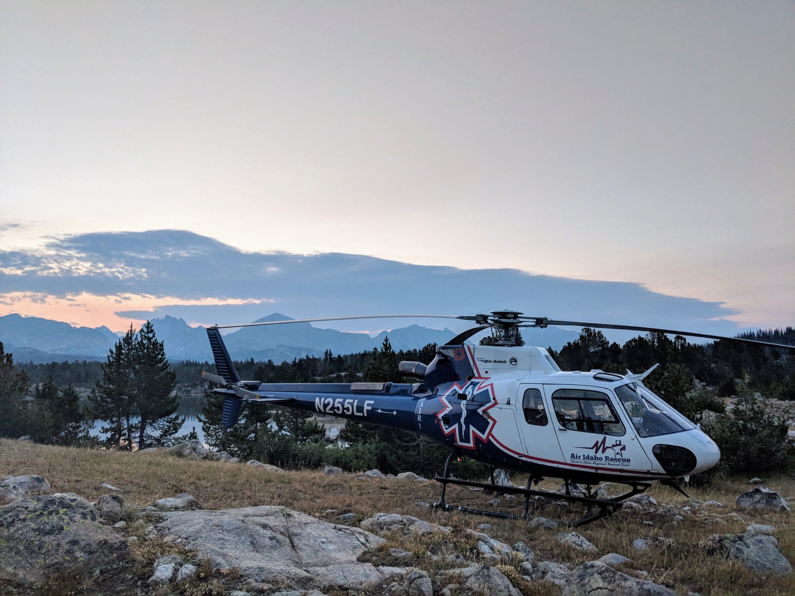 Air Idaho helicopter landed on mountain. 