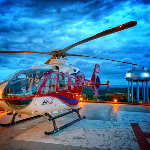 air medical helicopter on landing pad in city