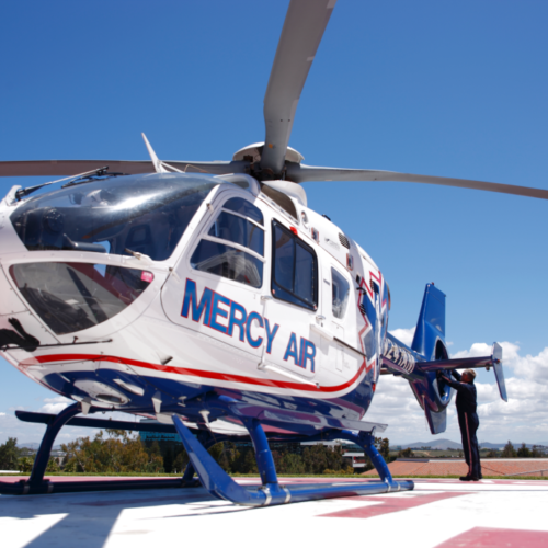 Mercy Air helicopter on launchpad.