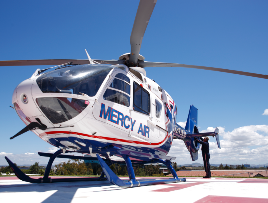 Mercy Air helicopter on launchpad.