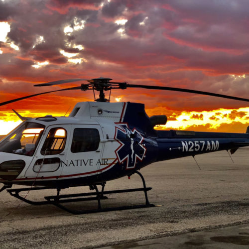 Native Air helicopter at sunset.