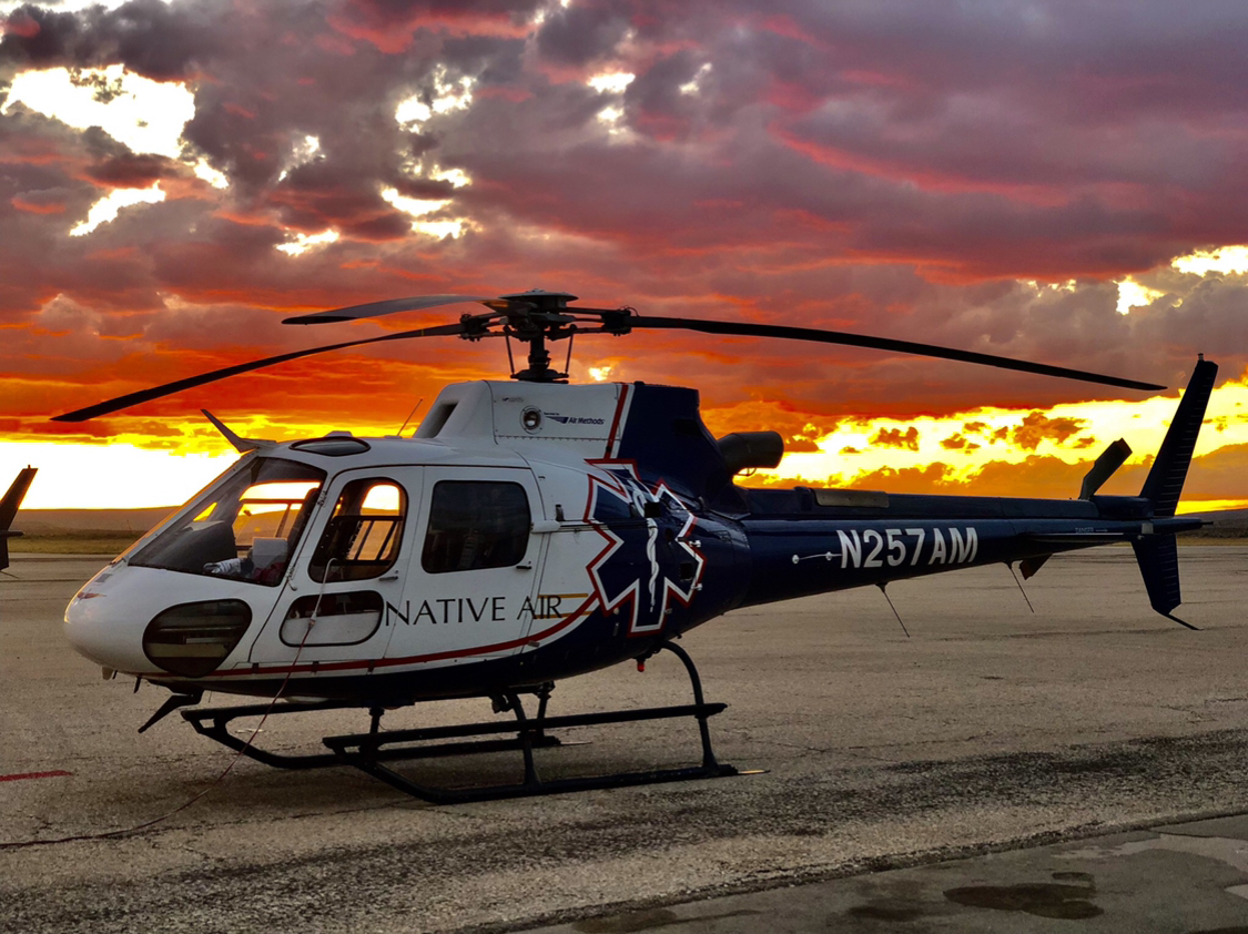 Native Air helicopter at sunset. 