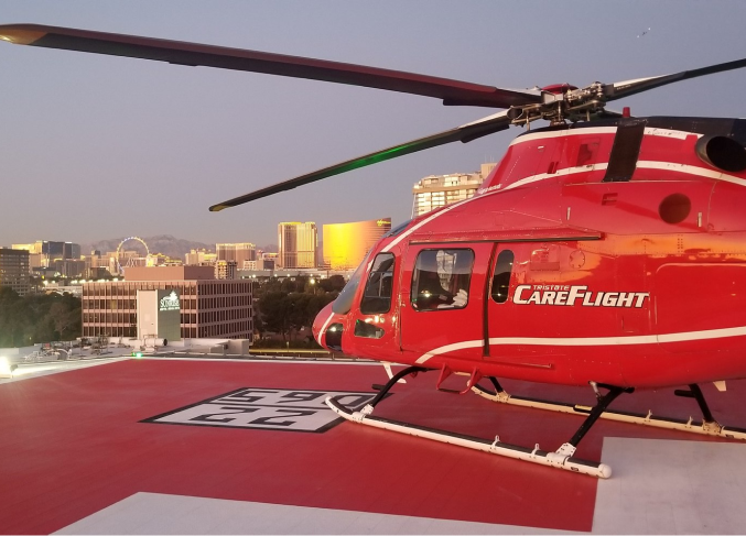 CareFlight helicopter on landing pad. 