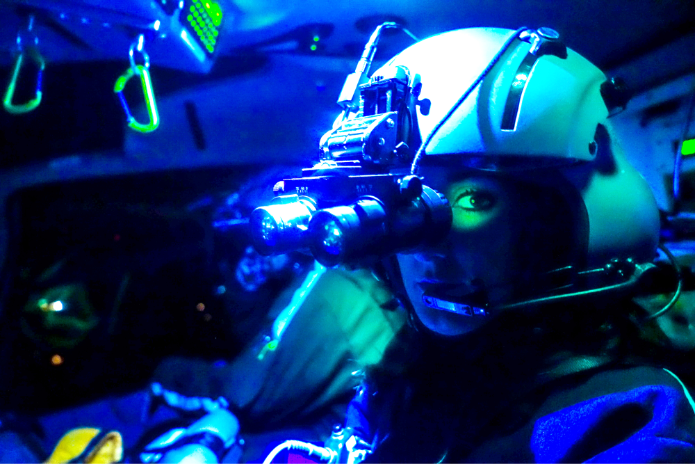 Pilot wearing night vision goggles. 