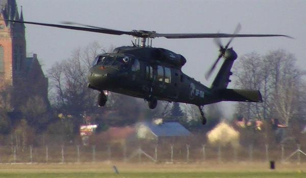 Military helicopter taking off. 