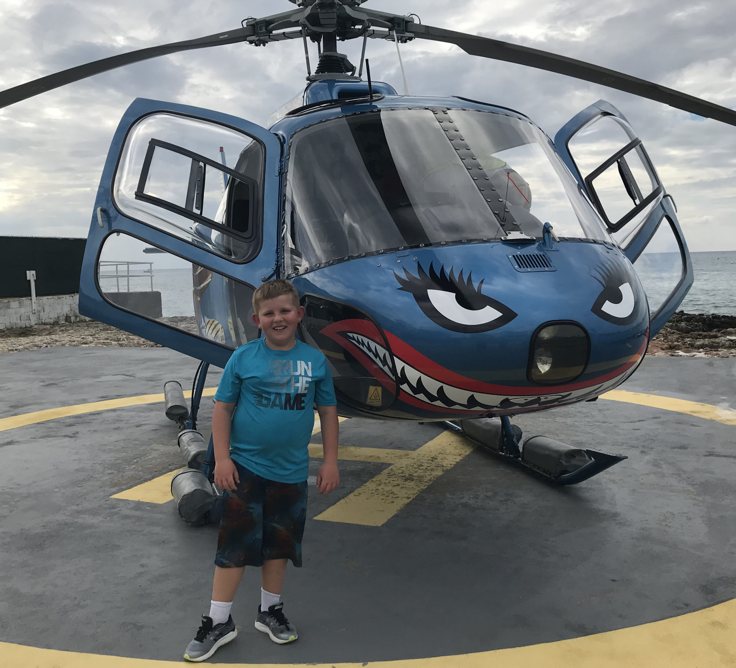 Sam Soulek in front of helicopter