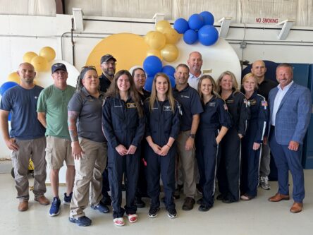 LifeSave crew stands in front of balloons for group photo